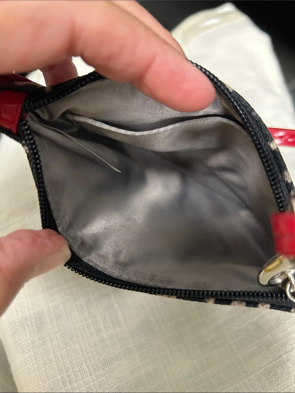 Coach wristlet featuring